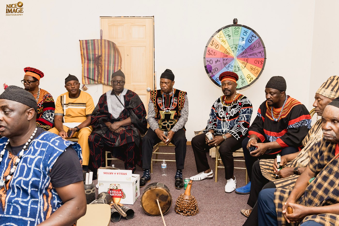 Kom community members gathered in a circle during Thursday's ceremony