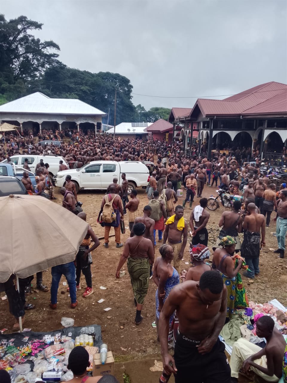 Kom community members in traditional mourning attire at Laikom