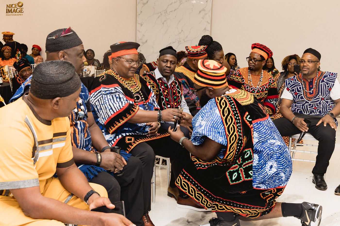 Kom elders sharing a ceremonial horn during Thursday's reception